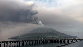 Indonesians leave homes near erupting volcano and airport closes due to ash danger